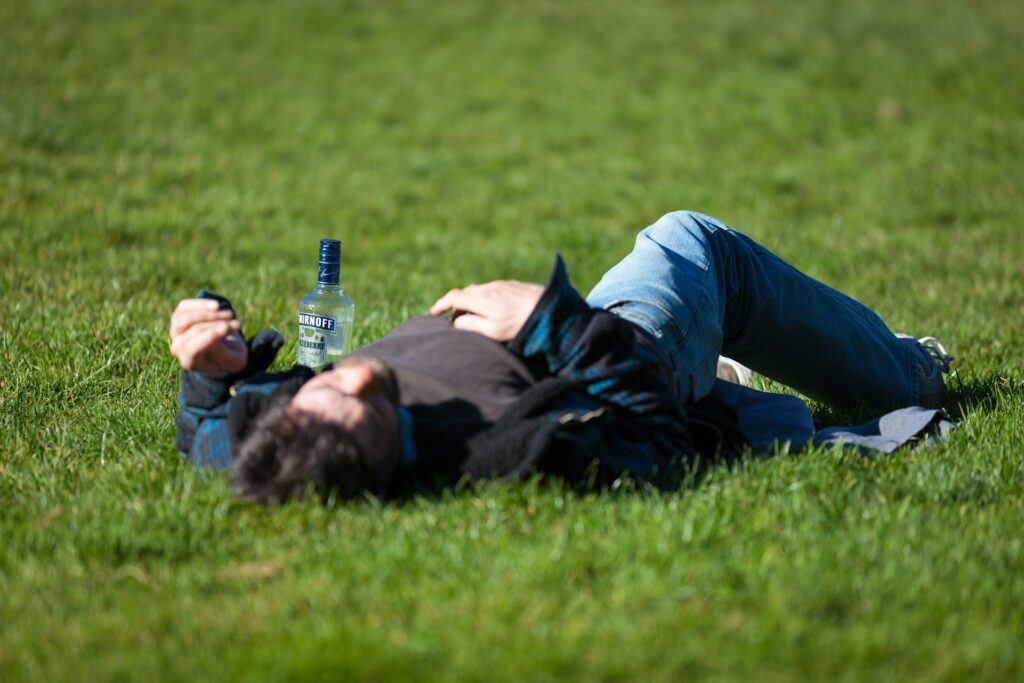 a very drunk man fell off the bench